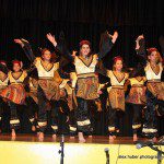 A group of people wearing traditional dance outfit